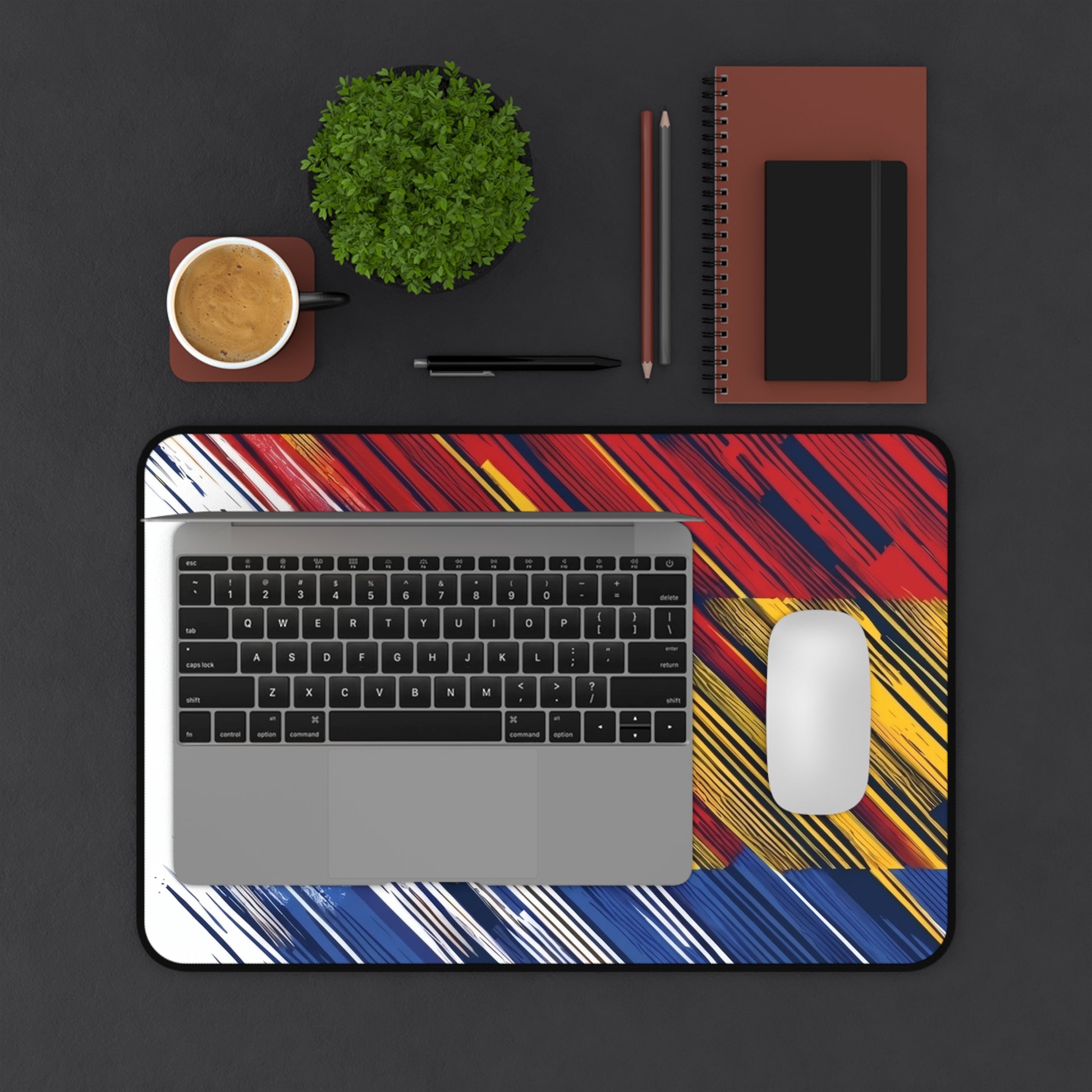 Colorful abstract flag brushstroke desk mat with red, yellow, and blue design, ideal for gaming or office use, by Printify.