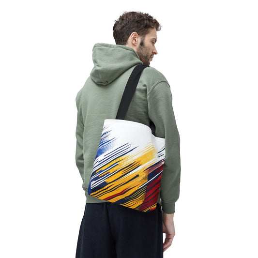 Abstract brushstroke tote bag with bold red, yellow, and blue all-over print, featuring a spacious design and sturdy handles.