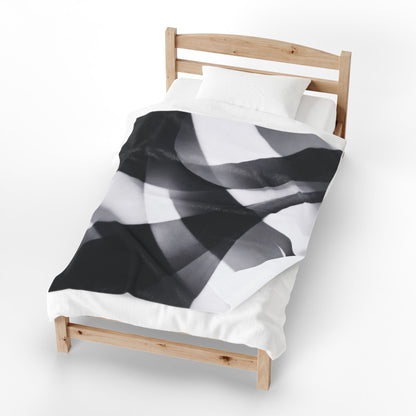 Velveteen plush blanket featuring an abstract black smoke swirl design with a monochrome all-over print by Printify.