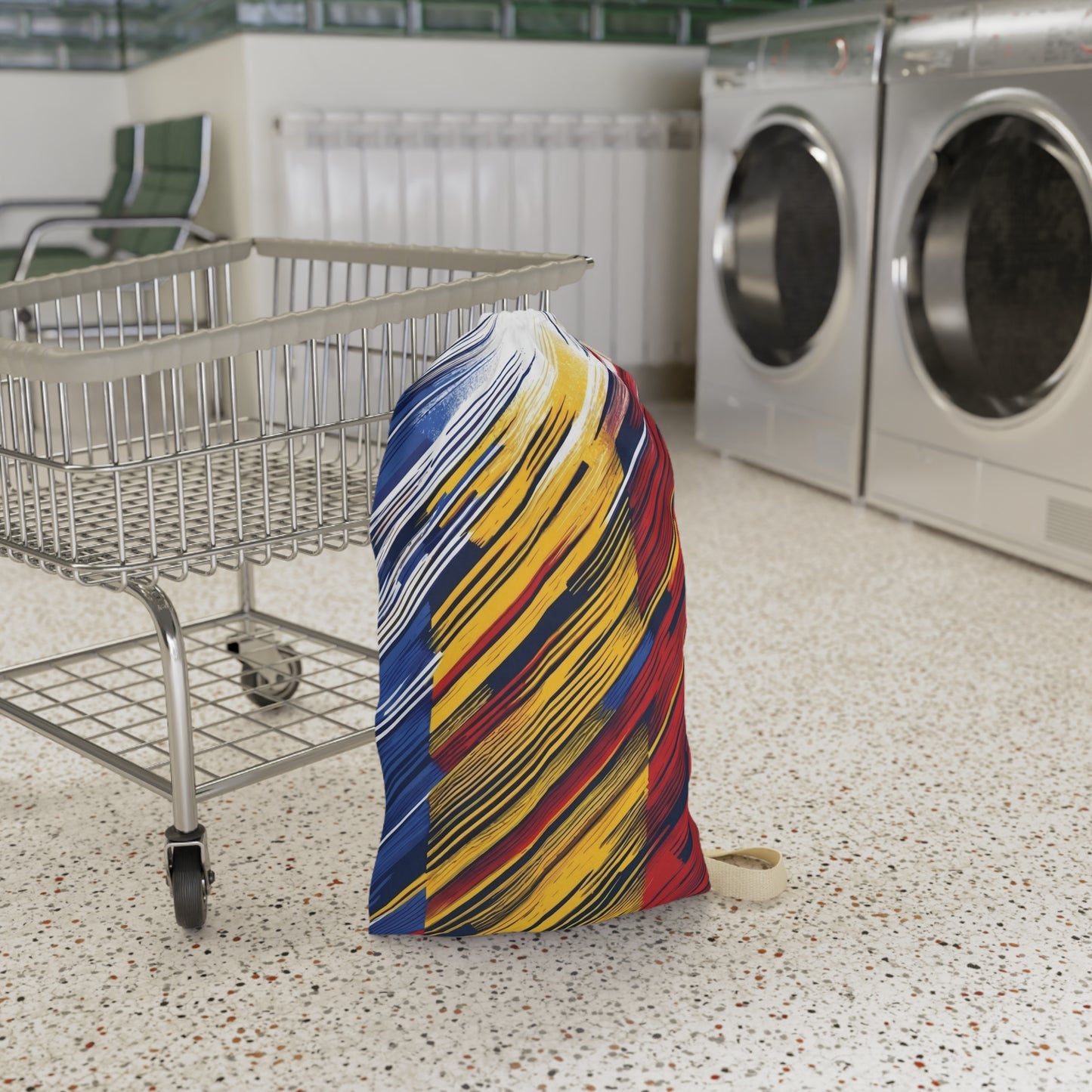 Colorful abstract brushstroke laundry bag with red, yellow, and blue tones, ideal for dorms and travel, by Printify.